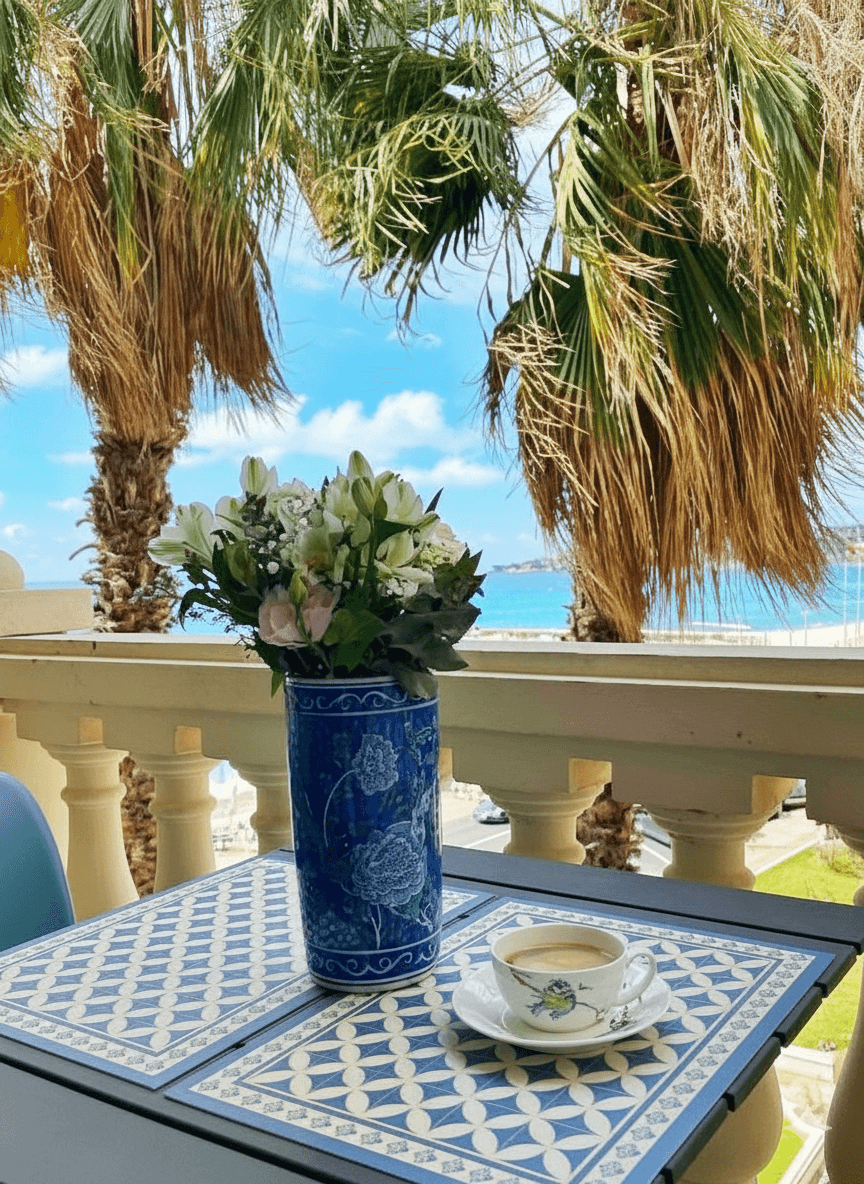 Private balcony table with coffee and Mediterranean sea view in Menton